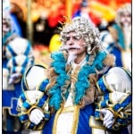 Person in elaborate colorful costume at a parade.