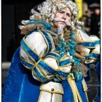 Person dressed as a whimsical king in blue costume.