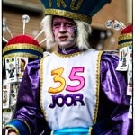Colorfully dressed person in a carnival costume
