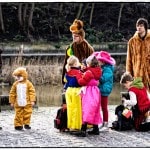 Group of people in colorful costumes outdoors.