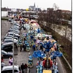 Colorful parade floats on city street.