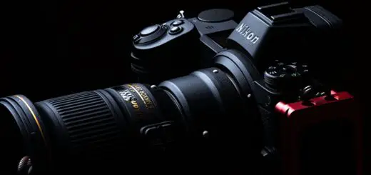 Black Nikon Dslr Camera on Black Surface